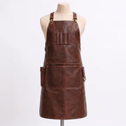 "Empty brown distressed leather barber apron with multiple pockets, shown on a mannequin, no tools inside."