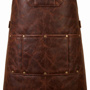 Close-up of leather apron lower tool pocket with divided compartments and brass rivet detailing