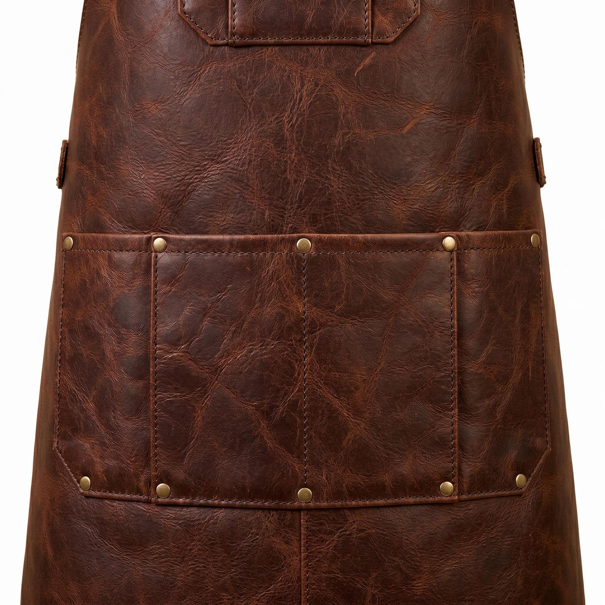 Close-up of leather apron lower tool pocket with divided compartments and brass rivet detailing