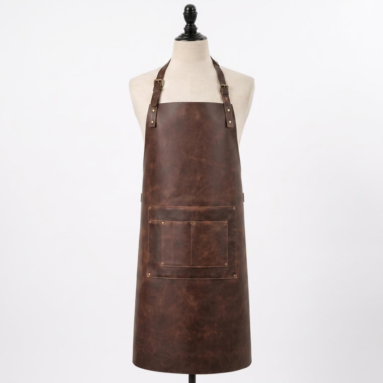"Brown distressed leather apron with front pocket, displayed on a mannequin against a white background."