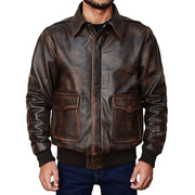 "Man modeling a distressed brown leather A-2 bomber jacket with flap pockets, worn open over jeans and a t-shirt."