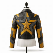 "Back view of a black leather jacket with bold yellow and gray star and lightning-bolt graphic panels, belted waist, displayed on a mannequin against a white background."