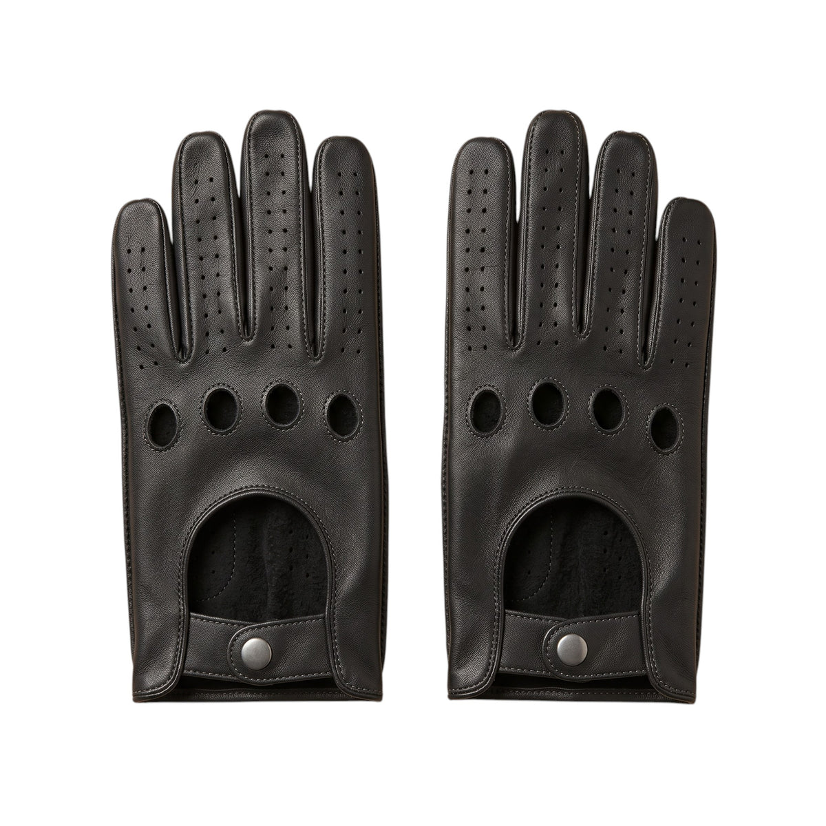 "A pair of black leather driving gloves laid flat side by side, each showing four circular ventilation holes, perforated fingers, and a snap-button wrist strap on a white background."