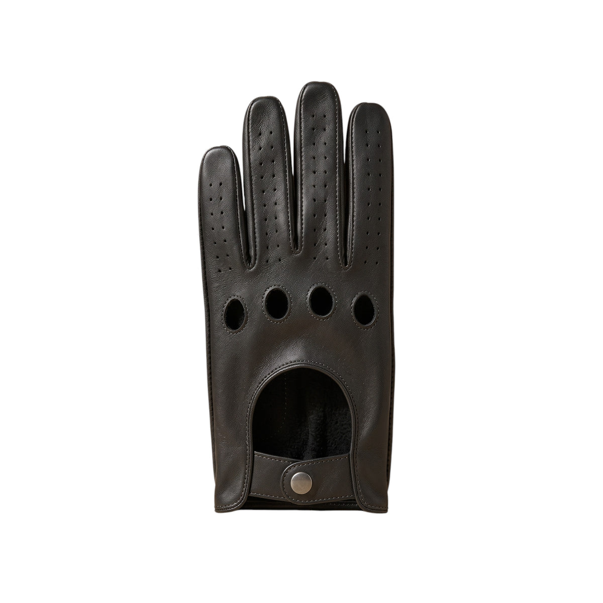 "A single black leather driving glove laid flat, showing four circular ventilation holes on the knuckle area, perforated fingers, and a snap-button wrist opening on a white background."