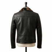 "Front view of a black leather biker jacket with animal-print fur lapel panel, zip pockets, belted waist, and asymmetric front zipper, displayed on a mannequin against a white background."