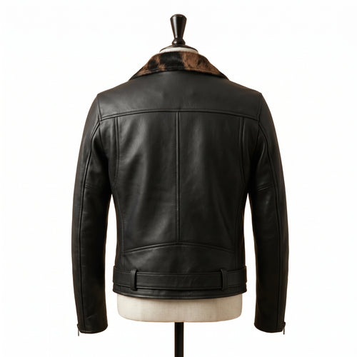 "Front view of a black leather biker jacket with animal-print fur lapel panel, zip pockets, belted waist, and asymmetric front zipper, displayed on a mannequin against a white background."