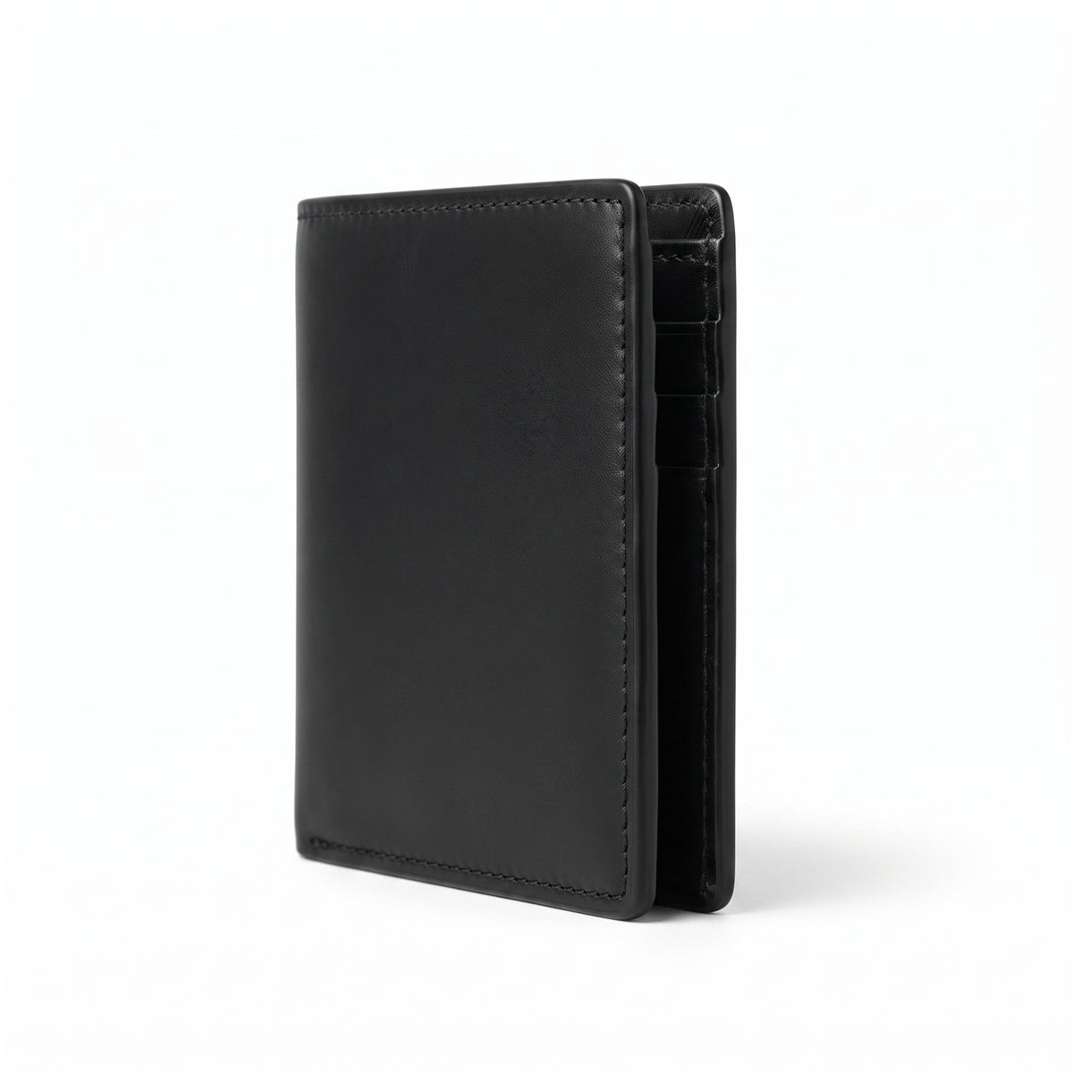"Black leather bifold wallet standing upright in a vertical/portrait orientation, viewed from a side angle, slightly fanned open to reveal an inner card compartment with a partially visible card slot lining, showcasing smooth leather texture and black stitched edges, photographed against a plain white background with a soft shadow beneath."