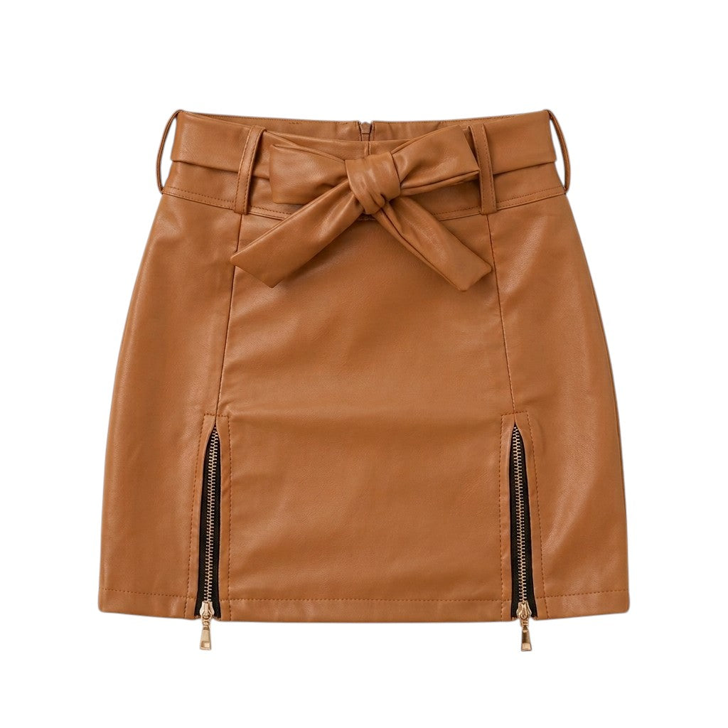 "Brown faux leather mini skirt with front tie bow belt, twin gold zipper details at hem, and back zip closure – women's fashion product photo on white background."