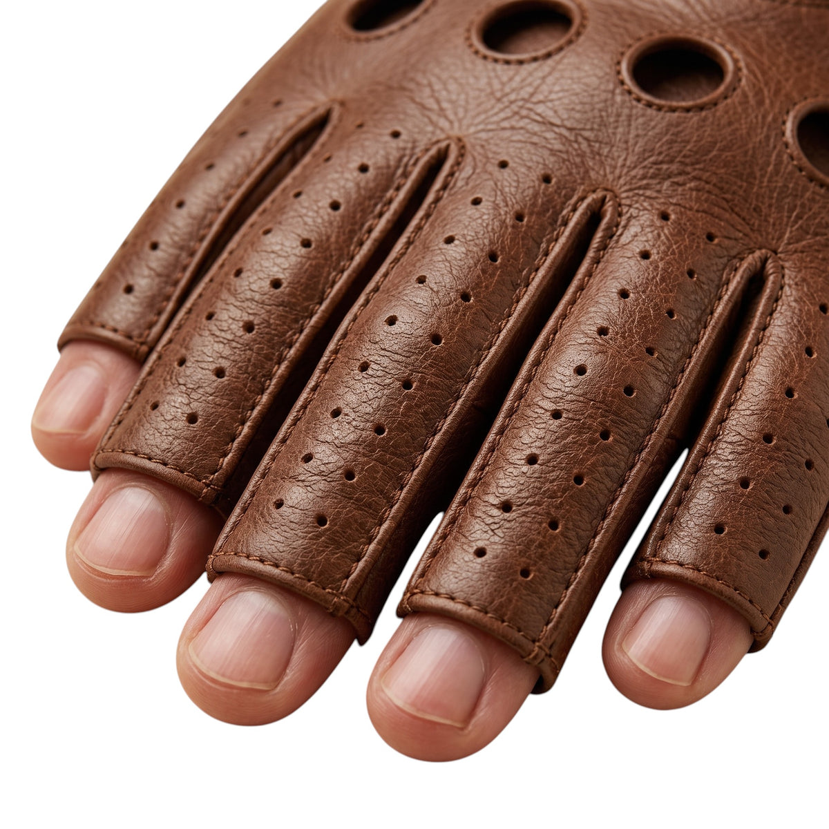 "Extreme close-up of a brown leather fingerless driving glove, showing exposed fingertips, perforated fingers, and stitched circular ventilation holes on the knuckles."