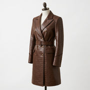 A brown crocodile-embossed double-breasted coat displayed on a mannequin against a plain white background.