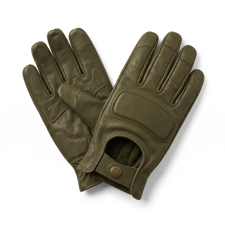 **"Pair of olive green leather motorcycle gloves crossed together"**