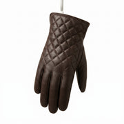 "A single dark brown leather glove hanging against a white background, showing a diamond-quilted stitching pattern on the back of the hand."