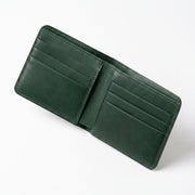 A dark green leather bifold wallet shown open, displaying multiple card slots on both the inside and outside, set against a plain white background.