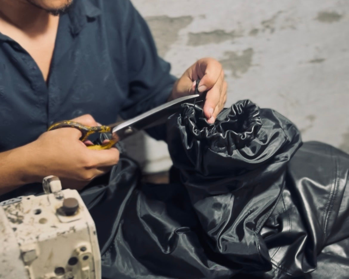 Inspector checking a finished leather jacket