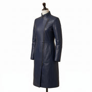 "Angled view of a navy blue leather coat with a stand collar, asymmetric diagonal zipper, and fitted silhouette, displayed on a mannequin against a white background."