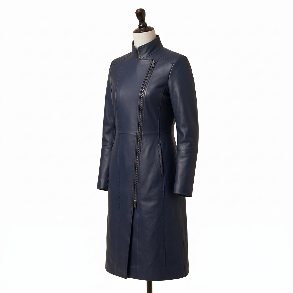 "Angled view of a navy blue leather coat with a stand collar, asymmetric diagonal zipper, and fitted silhouette, displayed on a mannequin against a white background."