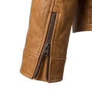 "Close-up of the front double zipper on a tan leather biker jacket, showing the metal zipper pulls, leather grain texture, and stitching in detail."