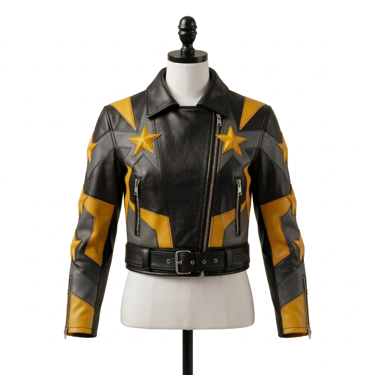 "Front view of a black leather biker jacket with yellow and gray star graphic panels, asymmetric zipper, zip pockets, and belted waist, displayed on a mannequin against a white background."