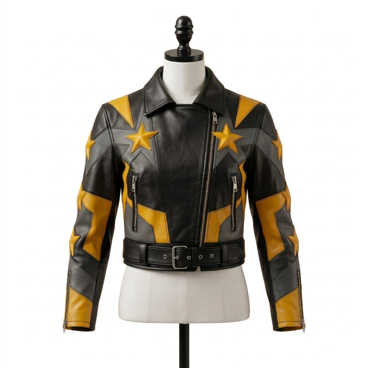 "Front view of a black leather biker jacket with yellow and gray star graphic panels, asymmetric zipper, zip pockets, and belted waist, displayed on a mannequin against a white background."