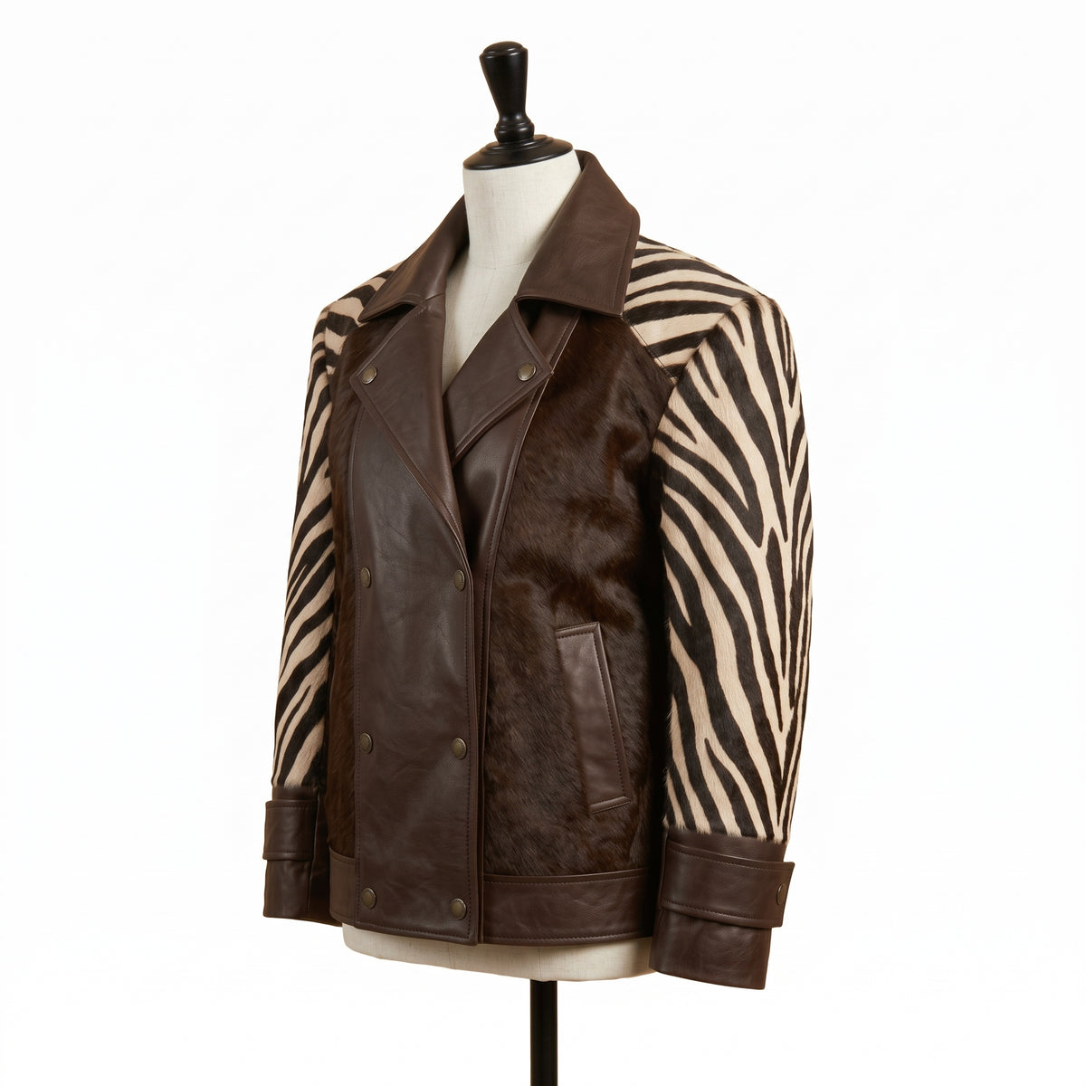 A brown leather and zebra-print jacket displayed on a mannequin torso against a plain white background.