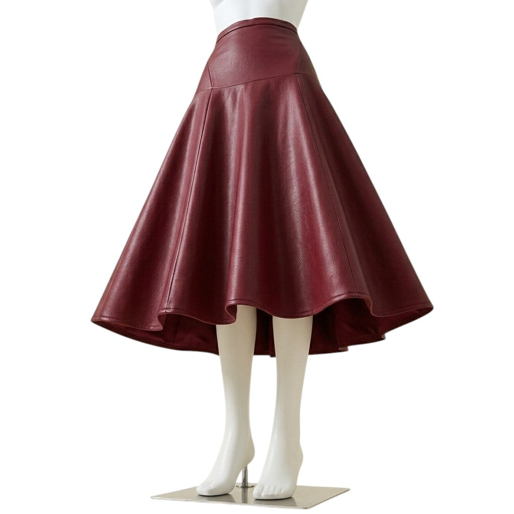 Maroon faux leather A-line midi skirt shown flaring outward with a flowing, voluminous hemline, displayed on a headless mannequin against a white background."