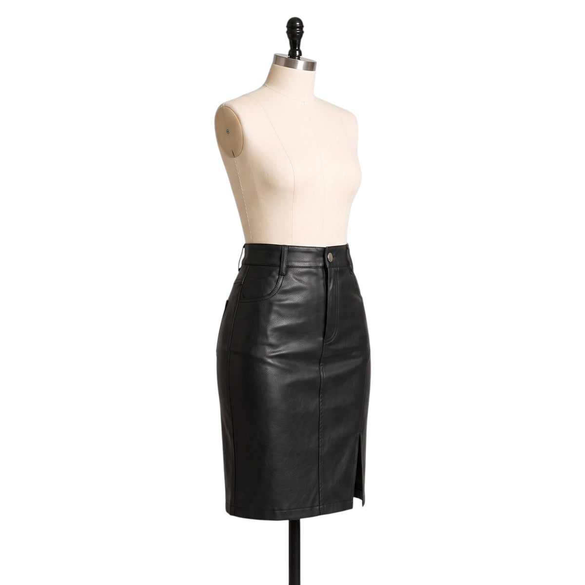 "Side angle view of the black leather pencil skirt on a mannequin, showing the button waistband, side pocket, and hem slit against a white background."