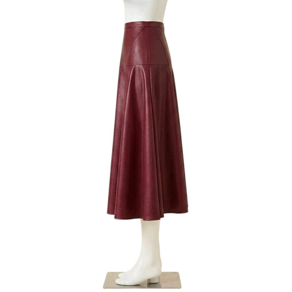 "Side profile view of a maroon faux leather A-line midi skirt with high waist and paneled seams, displayed on a headless mannequin against a white background."
