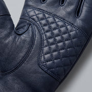 **"Close-up of navy leather glove palm with quilted diamond stitching"**