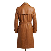 "Back view of the tan leather trench coat on a mannequin, showing the back yoke panel, waist belt, and adjustable cuff straps against a white background."