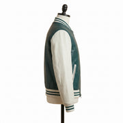 **"Green croc-embossed leather varsity jacket, profile view on mannequin"**