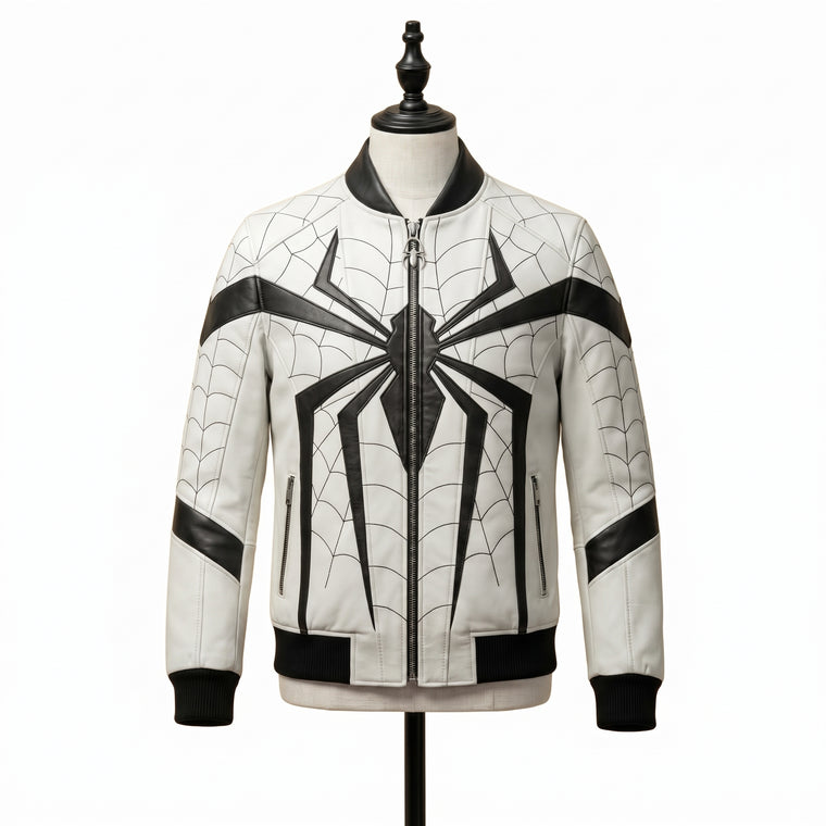 "Front view of a white leather bomber jacket with black web-pattern stitching, a black spider graphic down the front zipper, zip pockets, and black ribbed collar and cuffs, displayed on a mannequin against a white background."