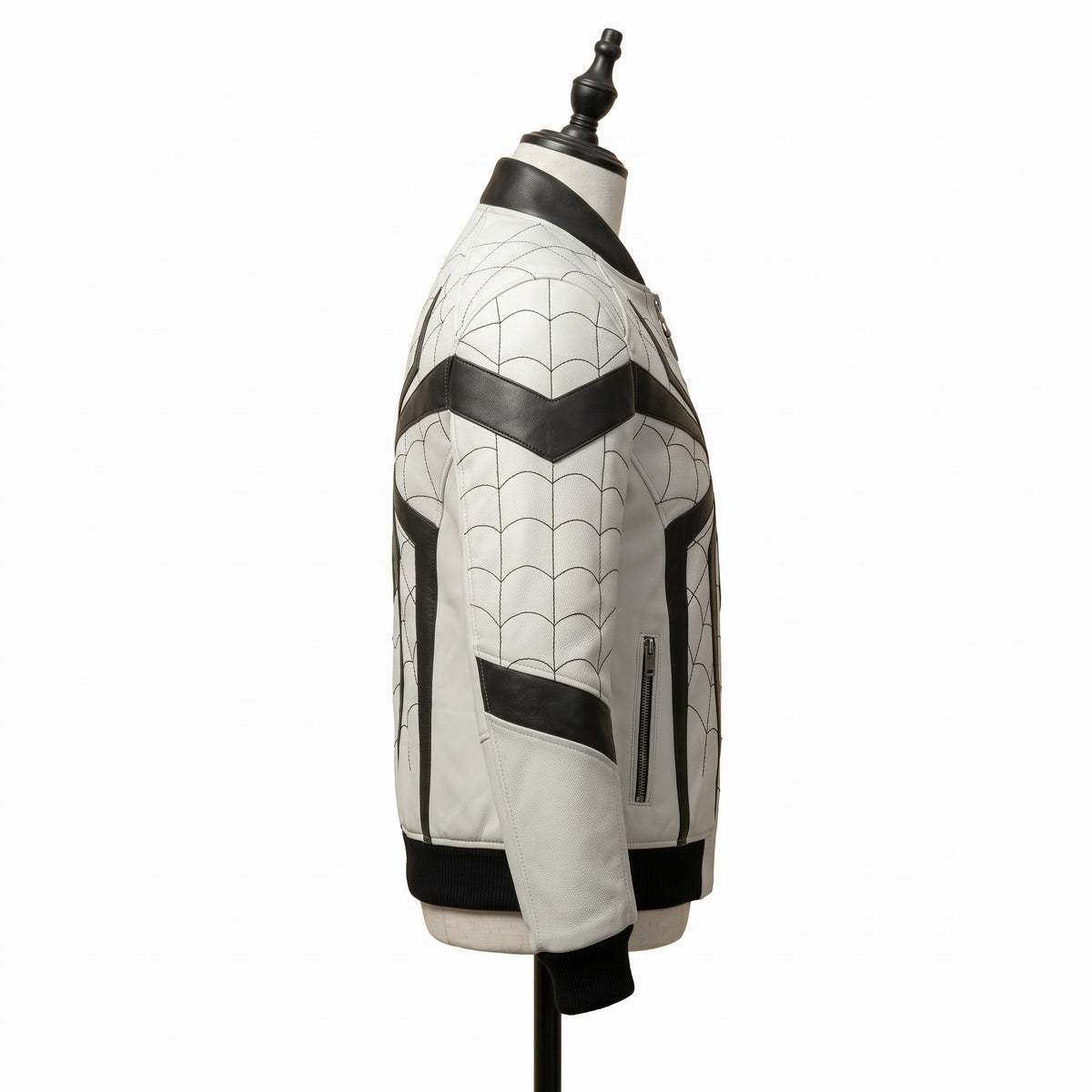 "Side view of a white leather bomber jacket with black web-pattern stitching, black chevron panels, and black ribbed collar and cuffs, displayed on a mannequin against a white background."