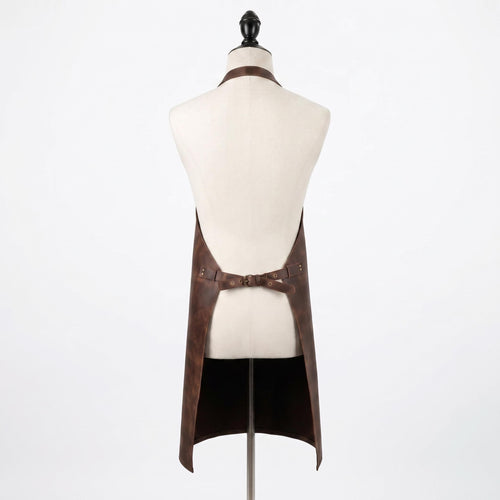 "Back view of a brown leather apron with crossed waist straps, displayed on a mannequin."
