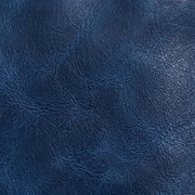 A close-up of dark blue textured leather material with visible grain and subtle sheen.