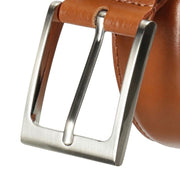 "Close-up of brushed silver prong buckle on tan leather belt with visible loop and stitching"