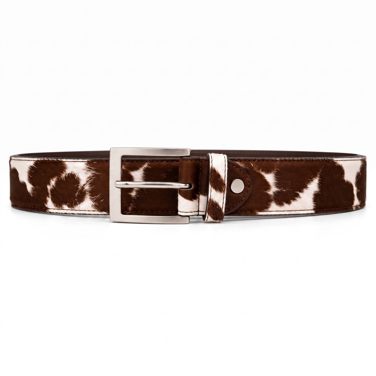 "Brown and white cow-print calf hair leather belt with a silver-tone metal buckle, laid flat on a white background."