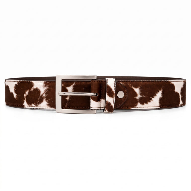 "Brown and white cow-print calf hair leather belt with a silver-tone metal buckle, laid flat on a white background."