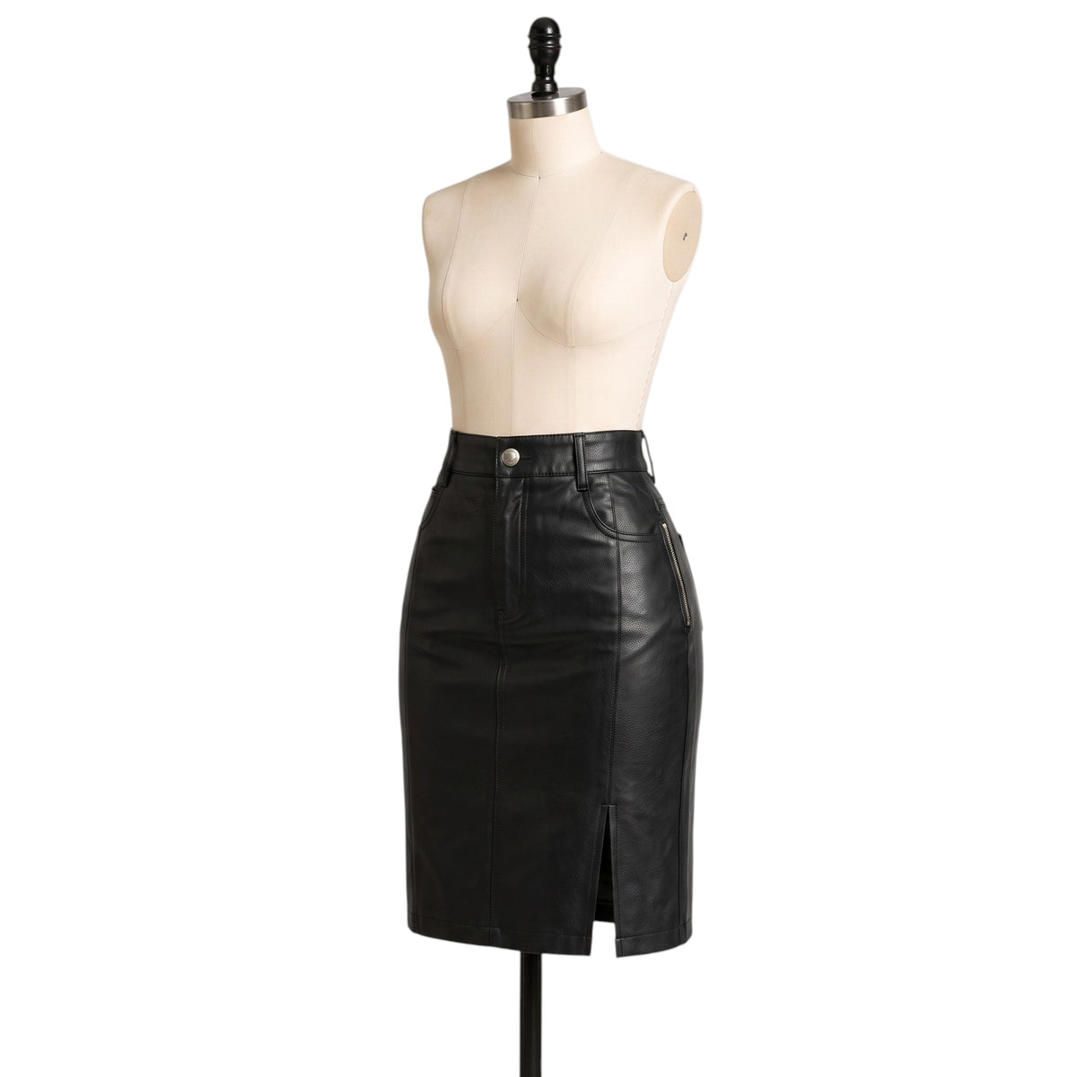 "Front-side angle view of the black leather pencil skirt on a mannequin, highlighting the button waistband, a zippered side pocket, and the front slit against a white background."