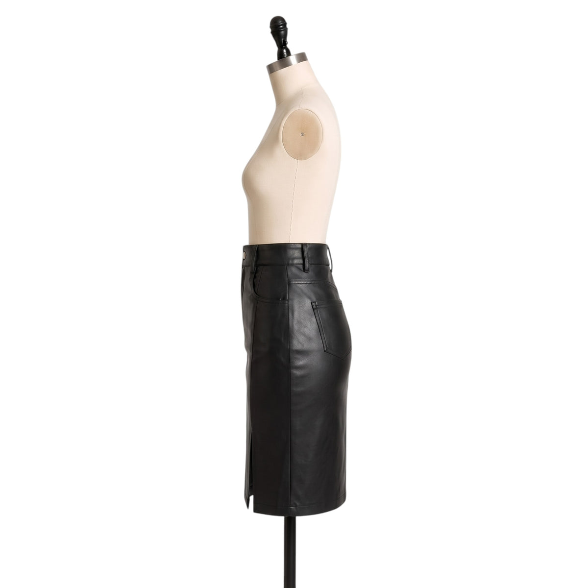 "Full side profile view of the black leather pencil skirt on a mannequin, showing the waistband, side pocket, and back slit silhouette against a white background."