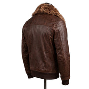 "Back three-quarter angle view of a dark brown distressed leather bomber jacket on a mannequin, showing the fur collar, back panel seaming, and ribbed cuffs against a white background."