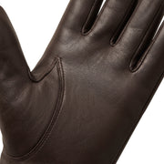 "Extreme close-up of the palm and thumb gusset area on a dark brown leather glove, showing the leather grain texture and seam stitching."