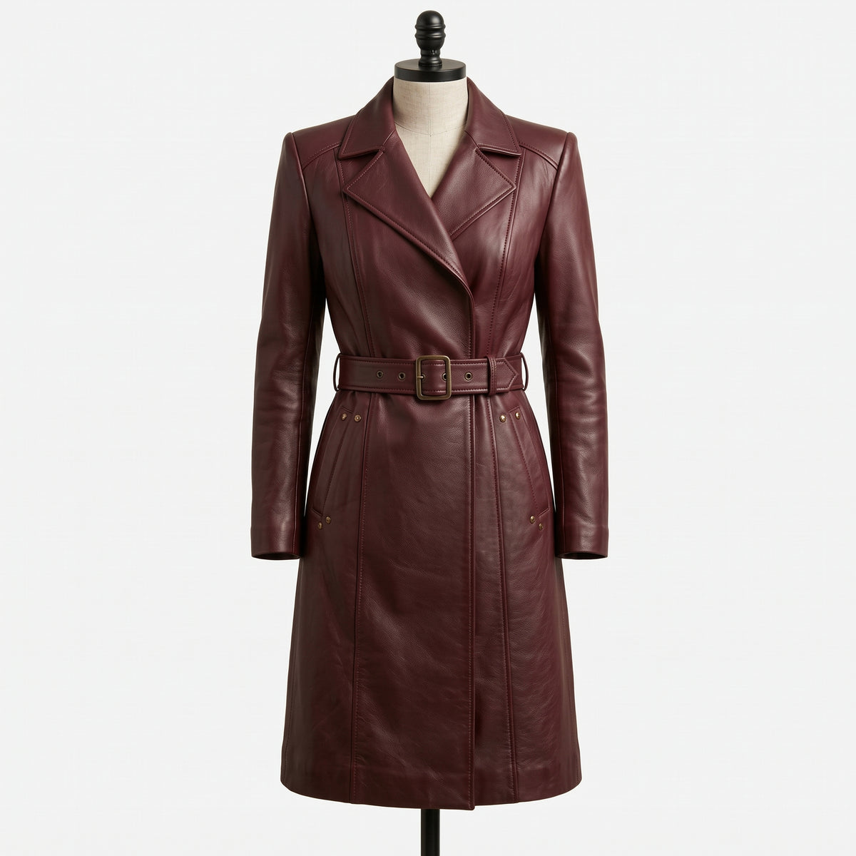 "Burgundy leather belted trench coat, front view on mannequin"