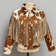 "Cowhide print fringe jacket with snap buttons and cream fringe, front view on mannequin display."